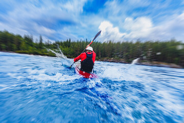 Sport Man is kayaking with spray paddle splashes. Summer day, travel concept
