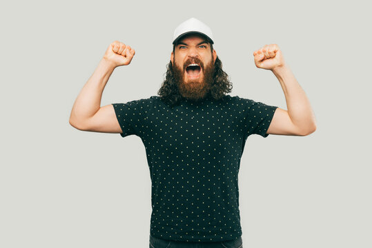 A picture of a bearded man screming and being angry