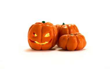 Polymer clay mini pumpkins isolated. Halloween handmade jack o lantern and pumpkins