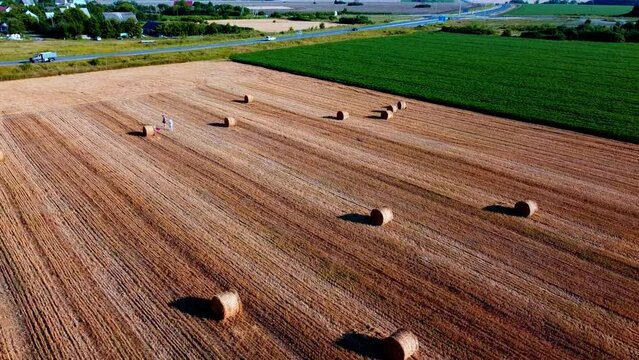Round haystacks on a harvested field in Ukraine