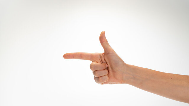 woman's hand gesture folded like a gun insulated on a white background