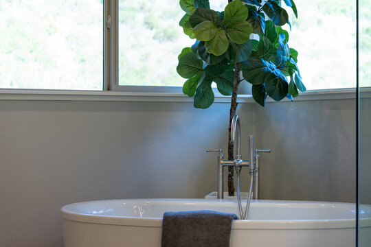 Simple Stand Alone Tub With Window Light.