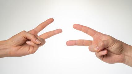 Hands close-up gesture from the game rock paper scissors
