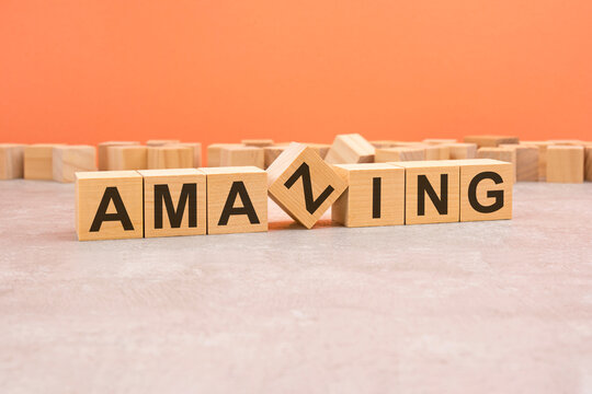 word amazing made with wood blocks. text is written in black letters, light background