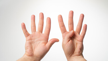 Men's hands gesture counting on fingers nine palmar side