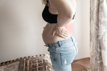 Pregnant pain back. Beautiful pregnancy woman having lower back pain. Feels backache. Ache therapy,...