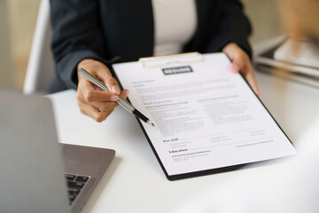 New graduate woman filling out an application form for HR department Review and review your...