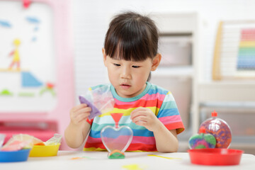 young girl making sand  crafts for homeschooling