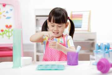 young  girl making sweet gems for homeschooling