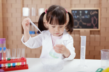 young girl plays  science experiment for home schooling