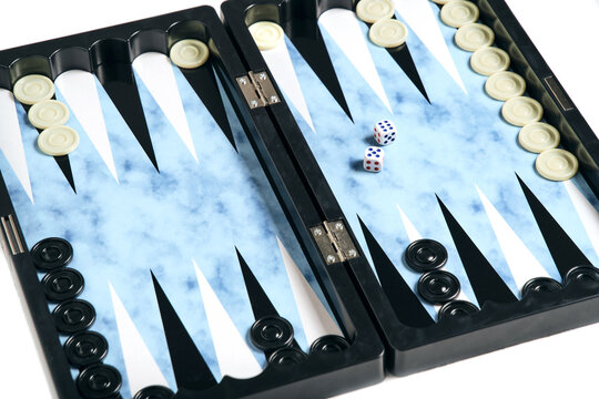 Board with cubes and chips for playing backgammon.