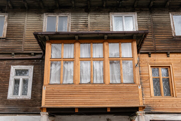 Obraz na płótnie Canvas Poland, Rabka-Zdroj – April 07, 2022: Big wooden house with balcony in vintage and gothic style