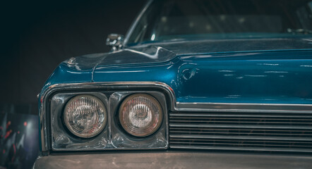 Classic car headlights close-up. The concept of a poster on the wall