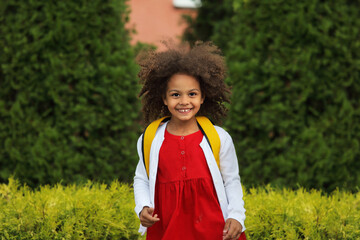portrait of Black child going back to school with a backpack
