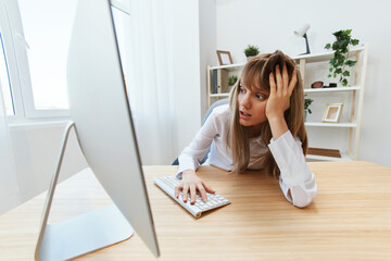 Shocked blonde businesswoman made big mistake in report look at screen recline on hand sitting at...