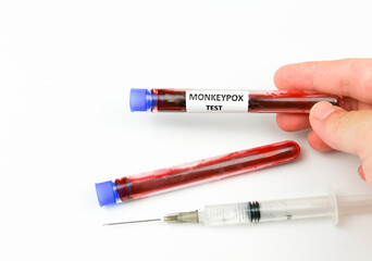Obraz premium Test tubes with blood for testing and syringe with Monkeypox vaccine