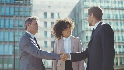 Cinematic footage of business colleagues talking about sales strategy during the break, celebrating the new deal. Concept about businesspeople and finance - Powered by Adobe