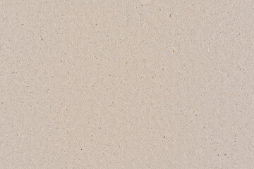 Fototapeta na wymiar Light brown or beige color cardboard recycled paper, seamless tileable texture, image width 20cm