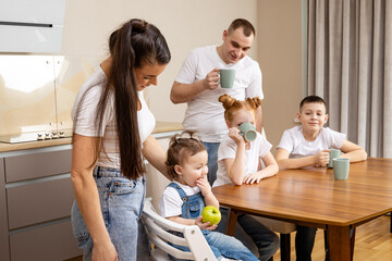 Fototapeta premium Happy family having breakfast together in kitchen