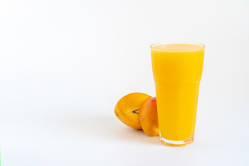 Fresh mango juice on white background with copy space.
