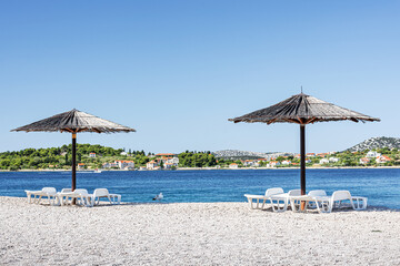 Straw umbrellas on the beach in Croatia