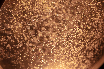 Golden champagne fizz bubbles background