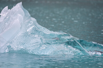 Close up of sparkling blue translucent icebergs in water of Kvanefjord in arctic Greenland © Nigel