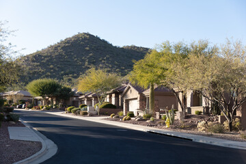 Southwest Arizona street and neighborhood homes with mountain in the background.