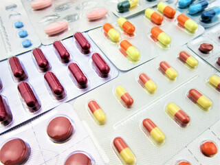  Colorful tablets and capsule pills in blister pack. Pharmaceutical industry. Drug and herbal interactions. Pharmacy pharmacy. Pharmacy concept. Health abstract. Pharmaceutical production