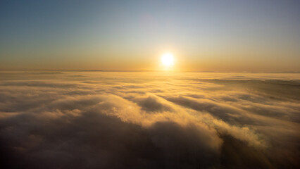 Sunrise, sunrise over a thick layer of fog in a small town in Brazil, drone photo.