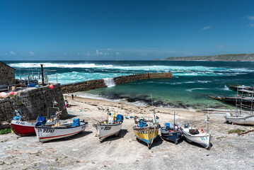 Fishing boats on slipway at Sennen Cove harbour, Cornwall UK 