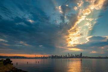 Seattle Skyline During the Morning Blue Hour Seen From West Seattle.  Dynamic view of the Seattle cityscape just before dawn with Elliott Bay in the foreground and the waterfront in the distance. 