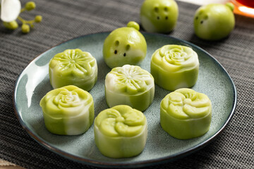 Traditional Chinese mid autumn festival dessert snowy skin mooncakes. The flavor is matcha green tea with pantan lotus paste