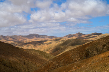 Hills against cloudy sky in nature