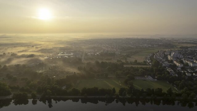 Neu-Ulm districts Offenhausen and Pfuhl at foggy morning with Danube time lapse