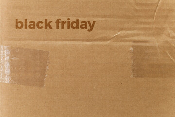 Detail of a cardboard box written on black friday. Delivery box. cardboard box concept. black friday concept