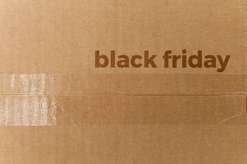Detail of a cardboard box written on black friday. Delivery box. cardboard box concept. black friday concept