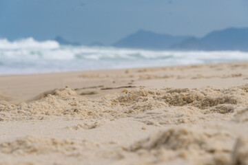 Fototapeta na wymiar Reserva Beach, in Rio de Janeiro. Sunny day with some clouds. Empty beach