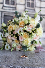 two wedding rings on the background bouquet