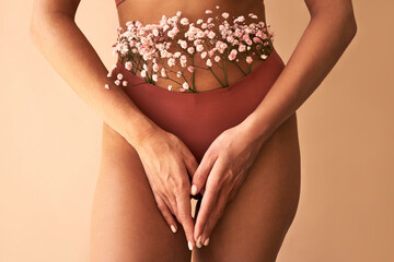   Cropped image of woman in lingerie with flowers made of panties.Women's health and care. - obrazy, fototapety, plakaty