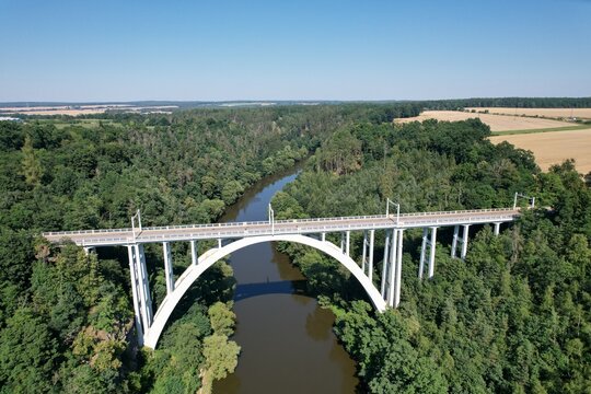 Bechyne Bridge or Bechyne Rainbow, rarely Rainbow Bridge is a unique reinforced concrete arch bridge over the river Luznice. Aerial view to monument in Czech Republic, Central Europe,for cars,trains
