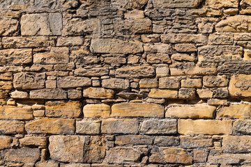 1 August 2022, Bishopmill, Elgin, Moray, Scotland. This is a Moray Sandstone wall in Bishopmill on a sunny day.