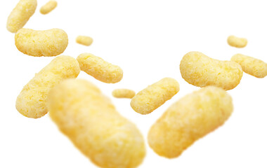 Flying corn sticks, isolated on white background