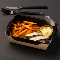 Hot fblack tea in a glass with double walls on a light background decorated flowers