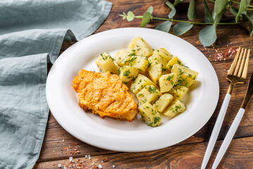 Chicken fillet in batter with potatoes
