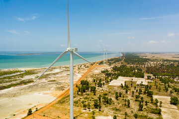 Wind turbines for electric power production on the seashore. Wind power plant. Ecological landscape. Jaffna, Sri Lanka.