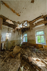 Fototapeta na wymiar Interior of sunlit room with broken ceiling