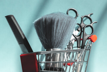 Shaking brush, scissors and comb lie in a mini basket on a blue background