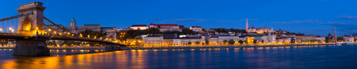 Fototapeta na wymiar Image of Chain Bridge near Buda Fortress in evening illumination of Hungary outdoor.