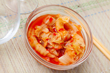 Korea food top view, Chinese cabbage kimchi in dish set on wooden background